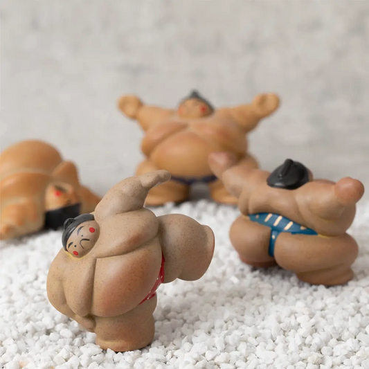 Each piece is hand-painted by a skilled artisan in Japan, giving each figure a slightly different, unique expression. They are made of semi-porcelain, and the lovable form of the sumo wrestler is going to bring a lot of charm to your life. The three stances would look wonderful together on your shelf or alone, scattered around. They encapsulate a Japanese cultural icon and can be a reminder of your desire to travel there or a trip you want to memorialize.