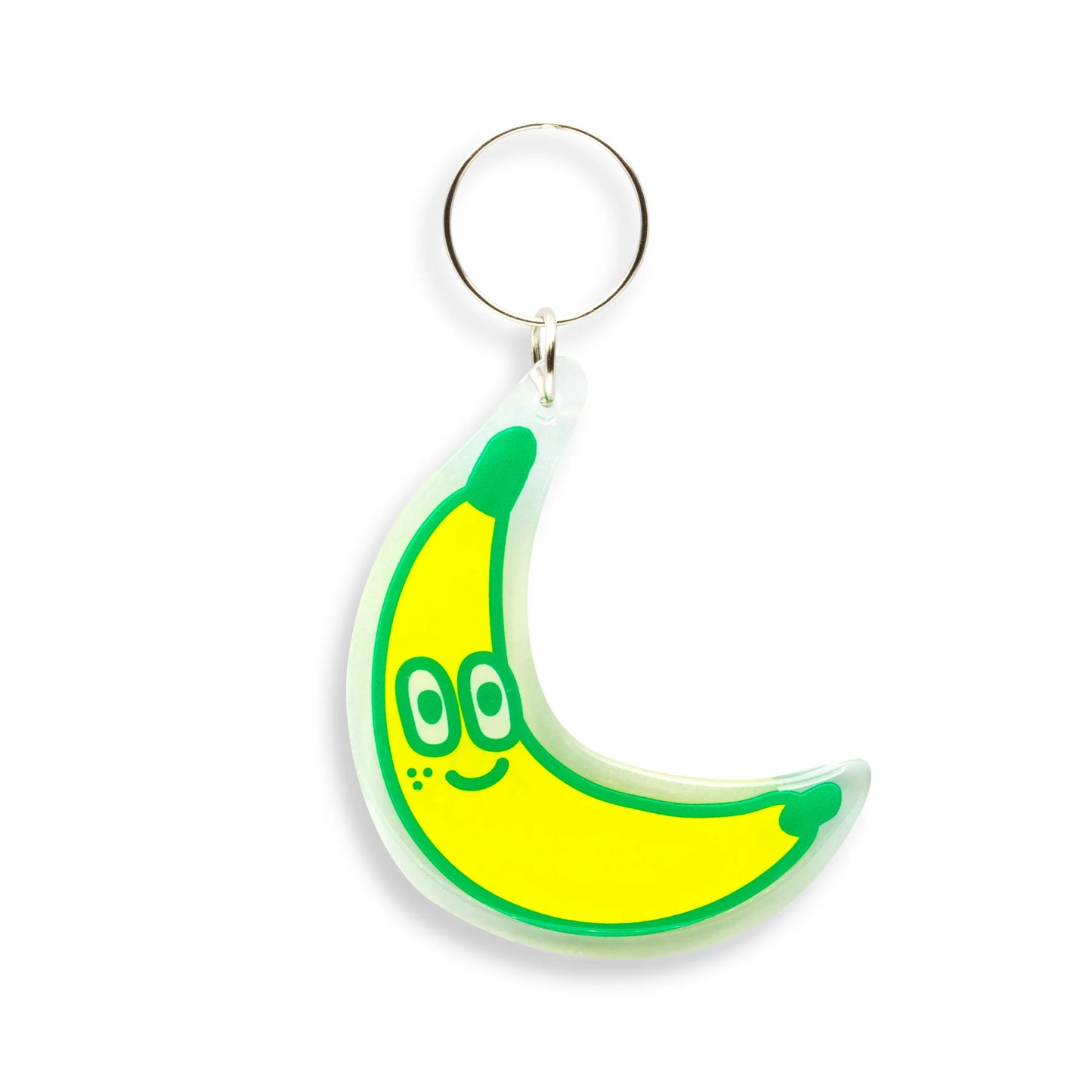 Banana-shaped keychain with a smiley face on a white background