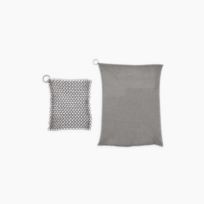 Stainless steel cleaning mesh for use with cast iron skillets and dutch ovens. Textured surface helps to remove stuck-on food, grime, and oil from pans and excels at heavy-duty cleaning. Built to last through years of frequent use and won’t scratch or scar your cookware. Dishwasher safe. An essential cast iron cleaning tool!