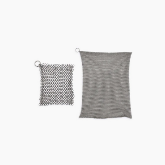 Stainless steel cleaning mesh for use with cast iron skillets and dutch ovens. Textured surface helps to remove stuck-on food, grime, and oil from pans and excels at heavy-duty cleaning. Built to last through years of frequent use and won’t scratch or scar your cookware. Dishwasher safe. An essential cast iron cleaning tool!