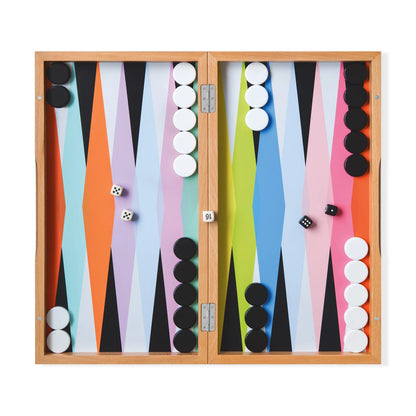 Colorful designed Backgammon set with black and white board game pieces. Games found at Huset Shop in Venice California. Scandinavian Design and joyful pastime and shopping.