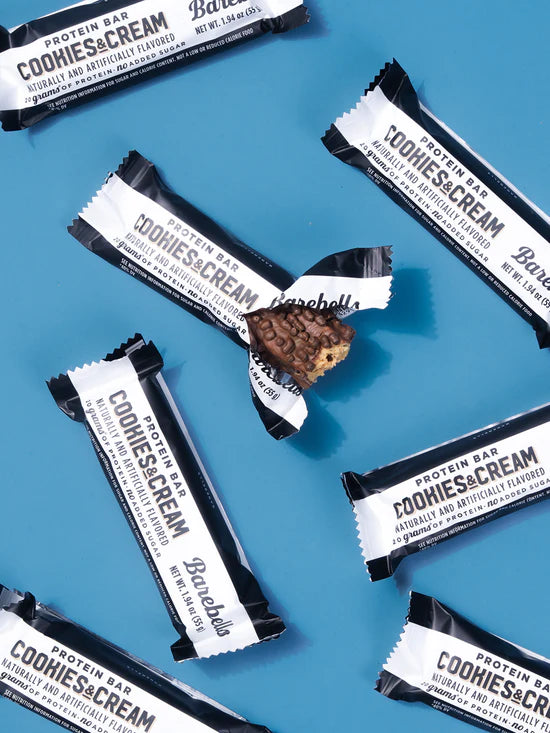 Protein bars with 'Cookies & Cream' flavor on a blue background
