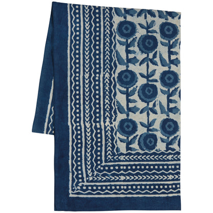 Blue and white patterned fabric with floral design on a white background
