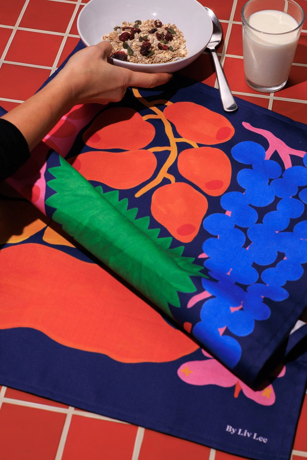 Printed on organic cotton and made in the UK, it is designed for everyday use while still feeling like a small piece of art. The rich colours bring warmth and depth to the kitchen.
