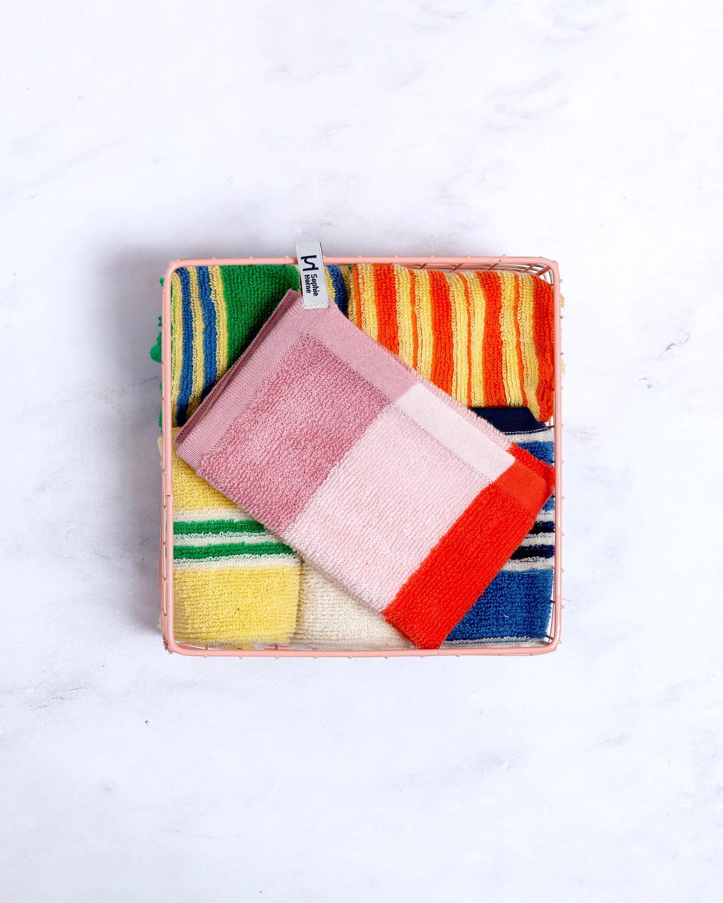 Colorful striped Towels in a box on a white background