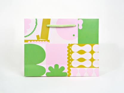 Colorful patterned gift bag on a white background