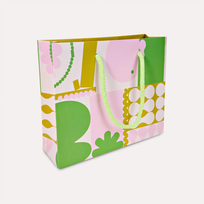 Colorful gift bag with floral design on a white background