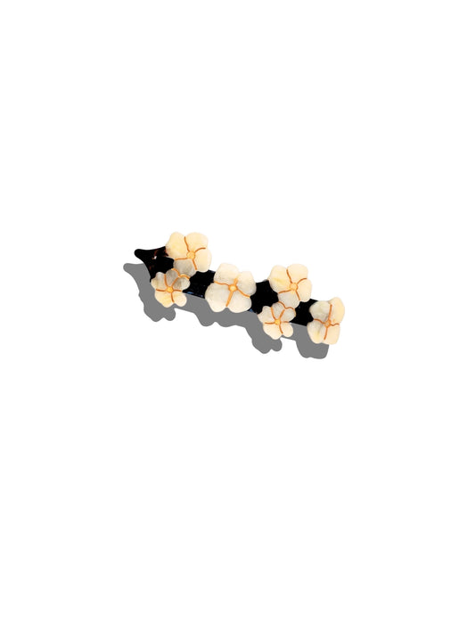 The Vintage Flowers French Barrette is hand-painted with delicate floral motifs inspired by antique wallpaper, pressed petals, and the soft elegance of a bygone era. It’s a graceful nod to vintage charm—perfect for sweeping back your hair with ease and beauty.