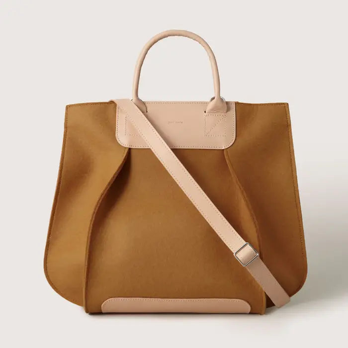 A perfect balance of form and function, the Frankie Tote is a versatile companion for daily life. Designed with two inner pockets, a magnetic top closure and a structured silhouette this tote offers ample space for essentials, work necessities, and more. The Frankie Tote is Graf Lantz's original iconic bag that has been featured in Vogue, Magnolia Journal, and Refinery29.&nbsp;The timeless design ensures Frankie transitions effortlessly from busy weekdays to casual weekends, delivering enduring quality and 