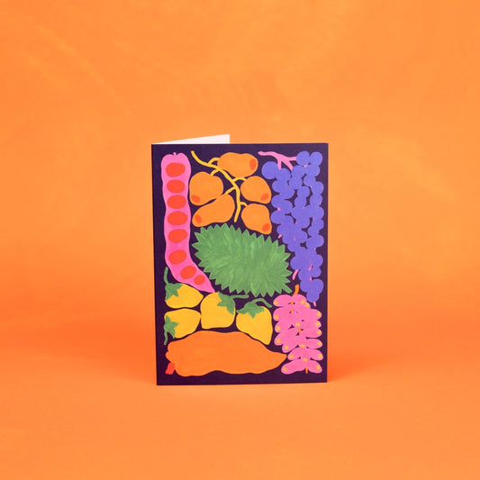 Colorful card with fruit illustrations on an orange background. This card supports animals and the Amazon rainforest.