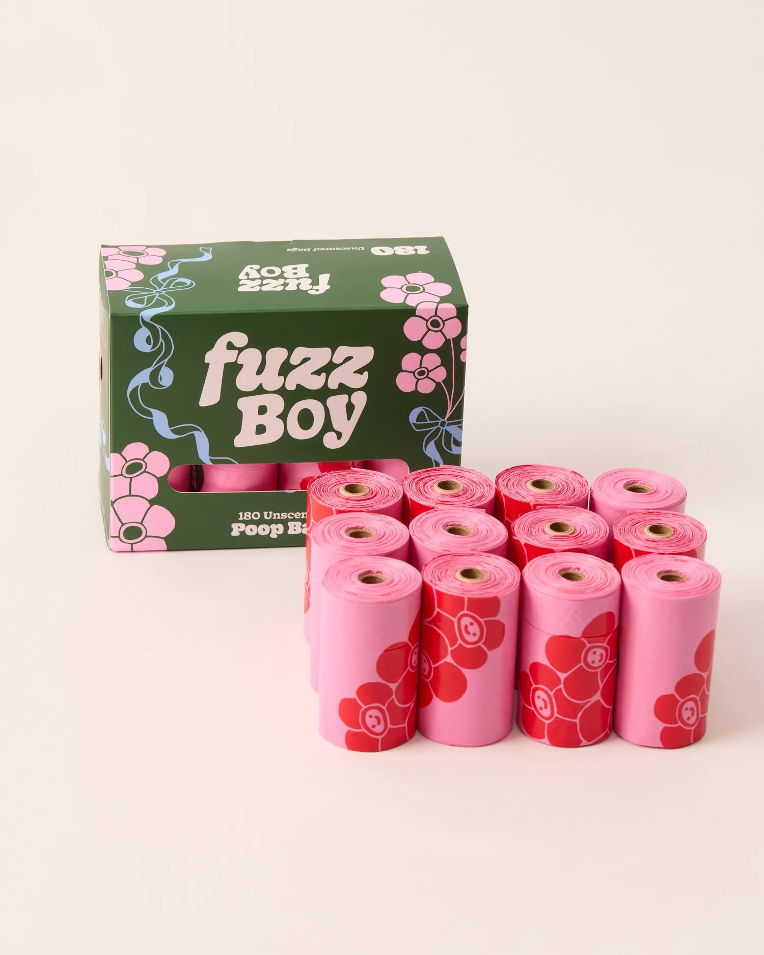 Pink pet waste bags with floral design and 'fuzz Boy' packaging on a white background