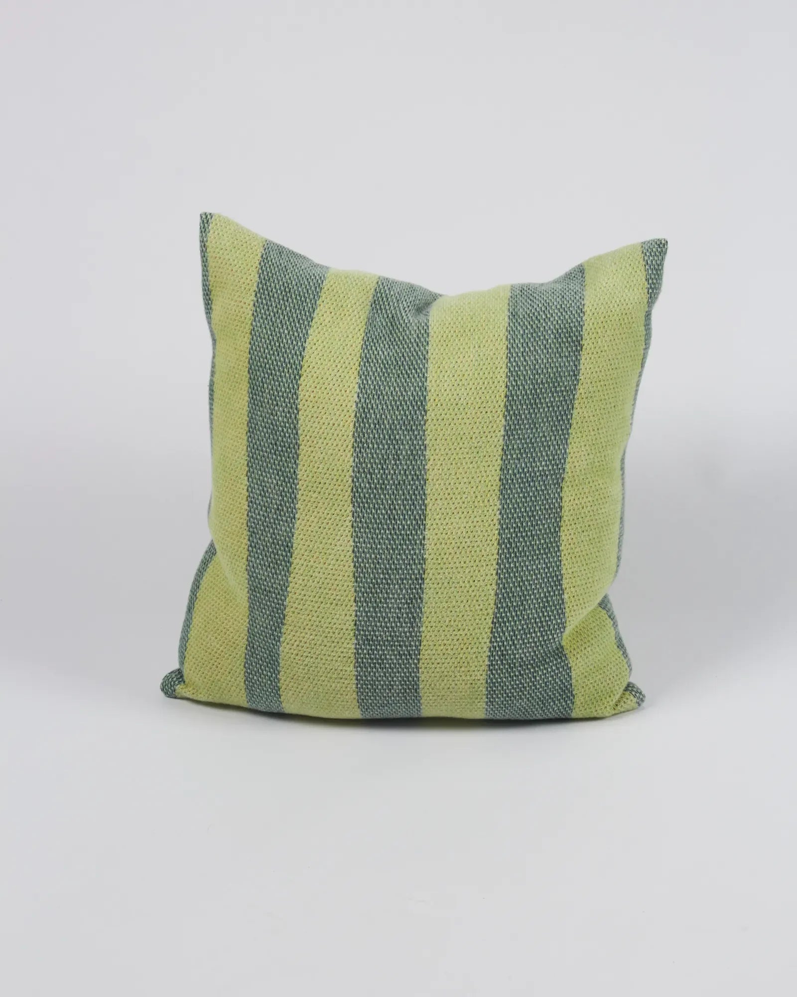 Green and gray striped pillow on a white background