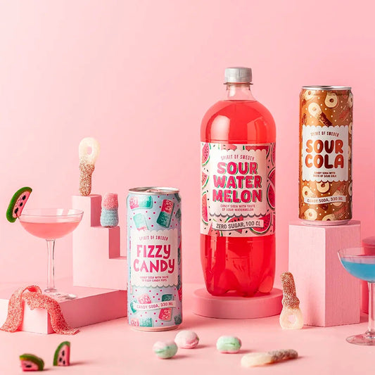Fizzy Soda products on a pink background with drinks and candy.