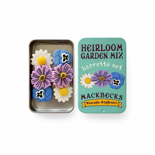 Barrette set with floral design in a Mackbecks branded tin on a white background