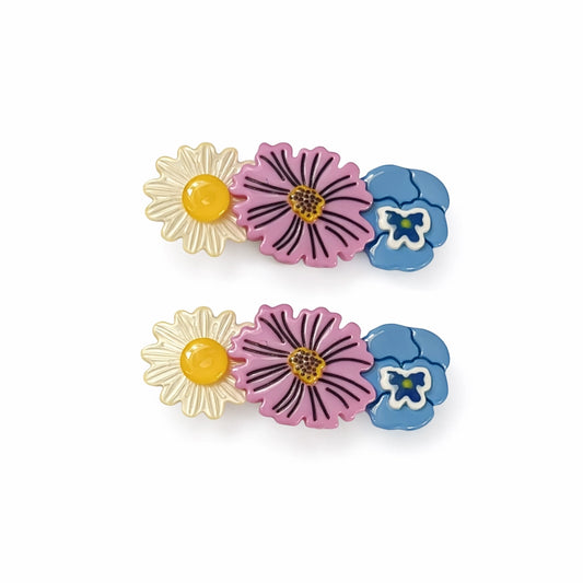 The Heirloom Garden Mix Barrette Set features a curated assortment of glossy floral barrettes, inspired by old-world seed packets and the mixed flower buckets you spot outside corner shops and neighborhood bodegas. Each bloom feels distinct but perfectly at home together — playful, colorful, and easy to wear.
Designed to clip in either direction, so you can style them your way — swept back, side-parted, or however the day unfolds. These barrettes add a soft pop of color without trying too hard.&nbsp;