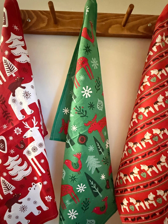 Set of three cotton towels with festive patterns reminiscant of Scandinavia. The Gnome, Dala Horse, Moose, Reindeers, and more all have Swedish workhorse quality. 