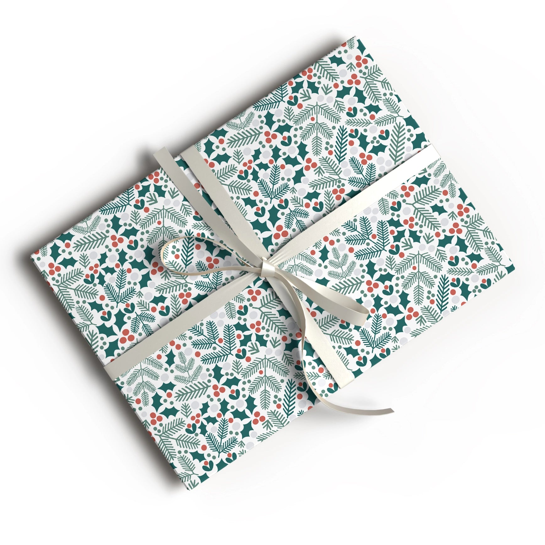 A gift box wrapped in festive holiday paper with a green and red holly and pine pattern, tied with a cream ribbon, shown on a white background.