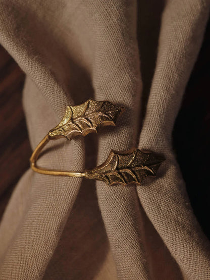 Inspired by nature, the Holly Leaf Napkin Rings echo the elegance of fine jewellery, lending a graceful and effortless accent to the holiday table. Crafted from cast brass, each ring features intricate detailing that reflects the organic beauty of holly leaves. Designed to wrap delicately around your napkins, they bring a sense of occasion to festive gatherings and meaningful moments alike.