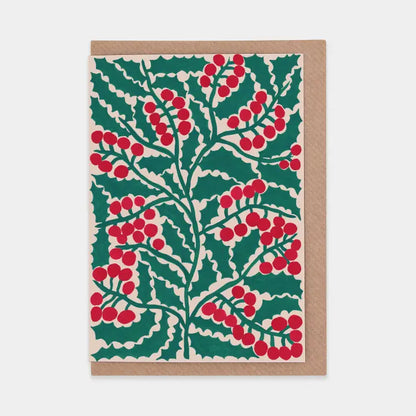 Greeting card with holly leaf and berry pattern on a white background