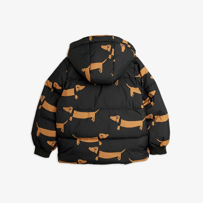A black hooded puffer jacket with an allover tan dachshund dog print, shown from the back against a light gray background.