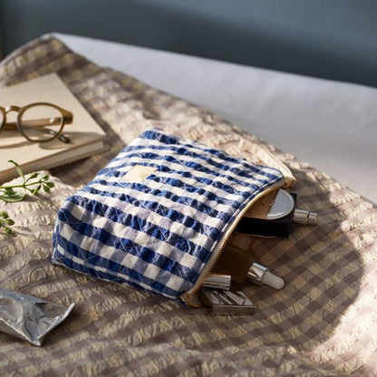 Measuring 9" x 6" x 2",&nbsp;the Nola toiletry bag is a timelessly cool quilted bag perfect for keeping your belongings in one place: makeup, stationery, electronics, or whatever you decide. The Nola bag is as practical as it is sustainable, and as stylish as it is versatile.