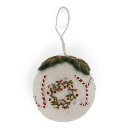 Felted ornament with embroidered design on a white background