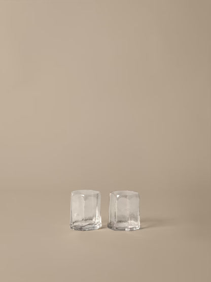 set of two glasses on beige background