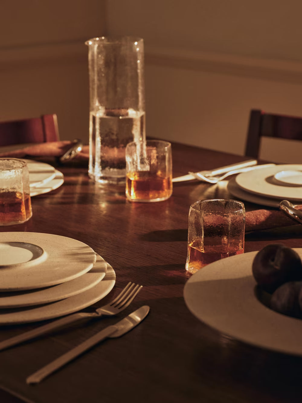 Dinner set up on wooden table warm 