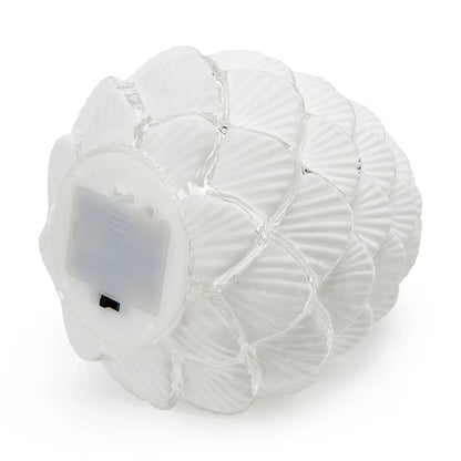 Decorative frosted glass pinecone light that uses batteries and lights up for a beautiful cozy ambiance in any space. Perfect for the holiday season and placing on a tablescape or on a mantel. 