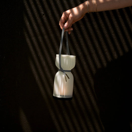 Initially inspired by the shape of water gourds and sake bottles, the Camp Lantern features a playful paracord sling handle, meant to encourage and highlight portability – hang it on a bedpost, take it on a picnic, or simply carry it with you around the house.&nbsp;
Cordless unit is USB-C rechargeable, features three dim-to-warm brightness settings, and lasts for up to 80 hours between charges.