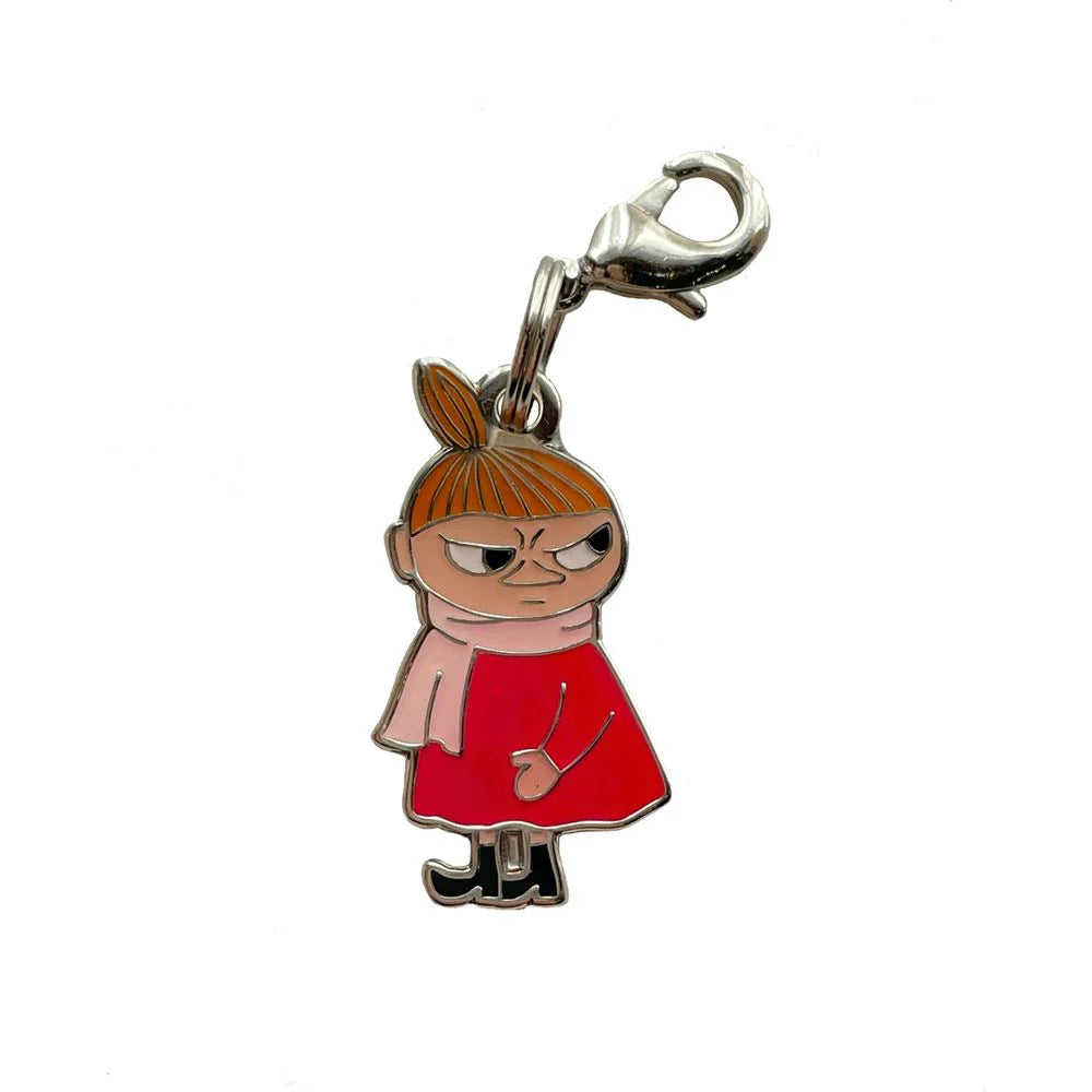 Keychain charm of a character named Little My from the show Moominvalley in a red dress with a white background she is always looking annoyed.