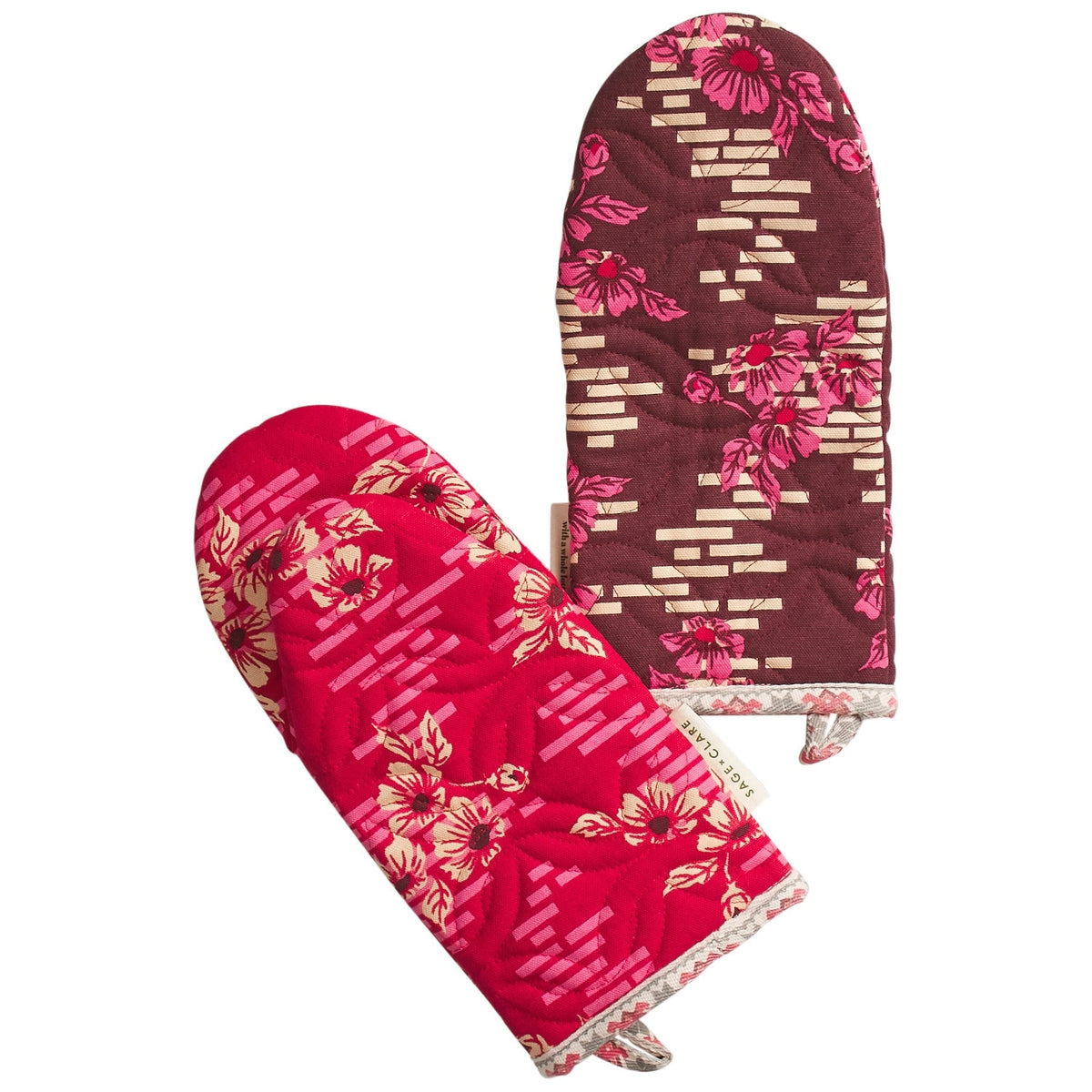 Pair of floral oven mitts on a white background