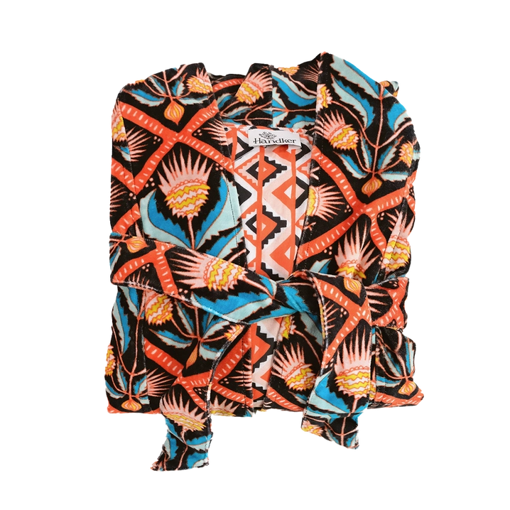 This duster coat is pure luxury, crafted of silky plush cotton velvet and smooth woven cotton on the reverse. We call this a duster because it can be worn as a robe or a coat--it even has pockets on both sides! This coat features a signature Handker hand-drawn pattern and is a cuddly hug no matter how you wear it.