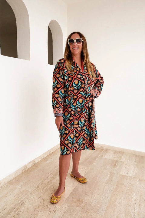 This duster coat is pure luxury, crafted of silky plush cotton velvet and smooth woven cotton on the reverse. We call this a duster because it can be worn as a robe or a coat--it even has pockets on both sides! This coat features a signature Handker hand-drawn pattern and is a cuddly hug no matter how you wear it.