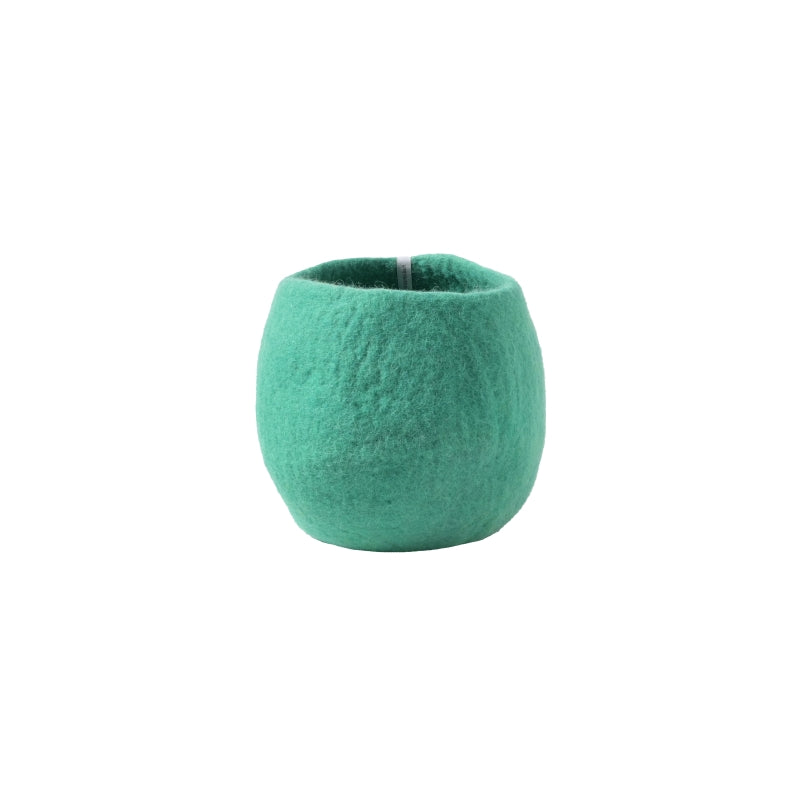 Green felted wool ball on a white background