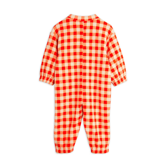 Red and white checkered baby onesie on a white background, Keep your little one cozy and cute in the Mini Rodini Gingham Fleece Overall! This soft, warm fleece features a charming gingham pattern that adds a playful touch to chilly days. Perfect for adventures indoors or out, it’s designed to keep your child snug while looking absolutely adorable. Easy to wear and easy to love!