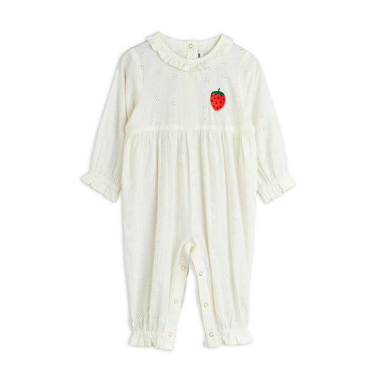 This Mini Rodini Strawberry Jumpsuit is a delightful organic cotton outfit designed just for kids. Its crisp white fabric is soft and gentle on little skin, while shiny gold snap buttons add a fun touch and make dressing a breeze. Perfect for playful days, this jumpsuit combines comfort with charming details like the strawberry that kids and parents will love.
