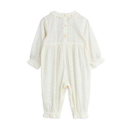 This Mini Rodini Strawberry Jumpsuit is a delightful organic cotton outfit designed just for kids. Its crisp white fabric is soft and gentle on little skin, while shiny gold snap buttons add a fun touch and make dressing a breeze. Perfect for playful days, this jumpsuit combines comfort with charming details like the strawberry that kids and parents will love.