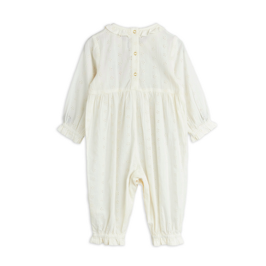This Mini Rodini Strawberry Jumpsuit is a delightful organic cotton outfit designed just for kids. Its crisp white fabric is soft and gentle on little skin, while shiny gold snap buttons add a fun touch and make dressing a breeze. Perfect for playful days, this jumpsuit combines comfort with charming details like the strawberry that kids and parents will love.