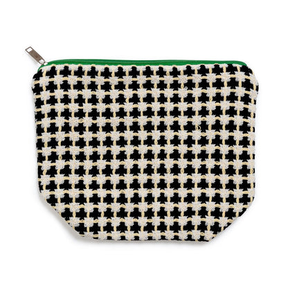 Houndstooth patterned pouch with a green zipper on a white background