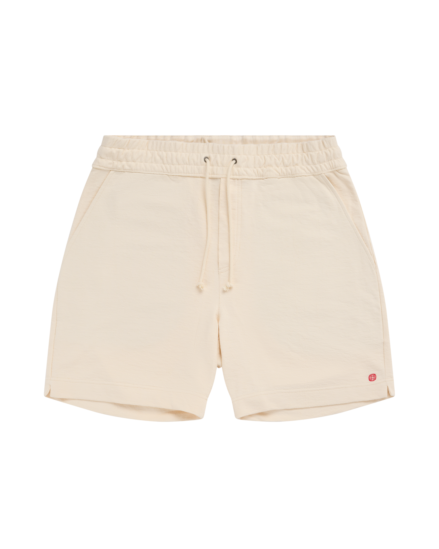 Beige shorts with a small red logo on a white background
