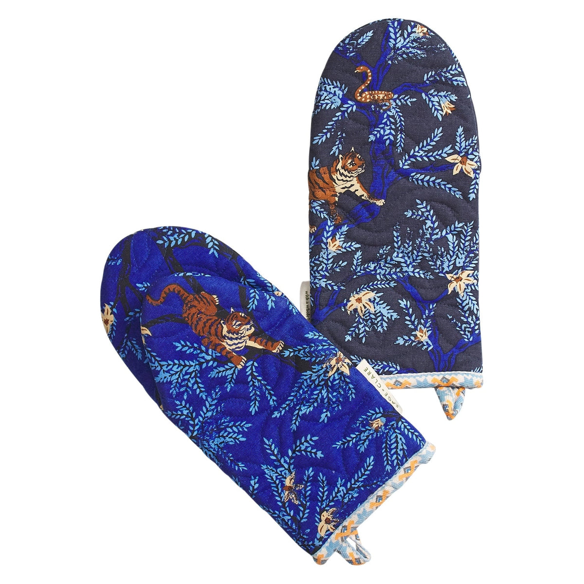 Pair of blue oven mitts with tiger design on a white background
