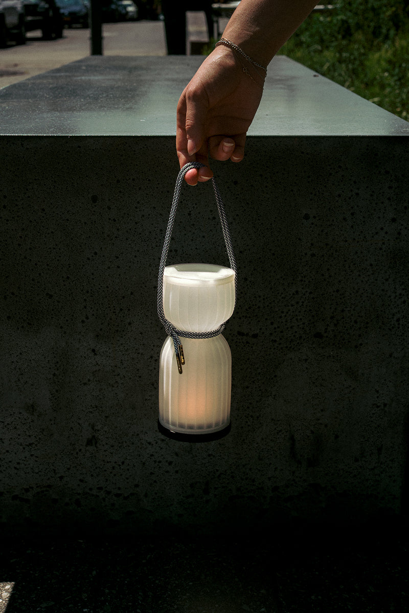 Initially inspired by the shape of water gourds and sake bottles, the Camp Lantern features a playful paracord sling handle, meant to encourage and highlight portability – hang it on a bedpost, take it on a picnic, or simply carry it with you around the house.&nbsp;
Cordless unit is USB-C rechargeable, features three dim-to-warm brightness settings, and lasts for up to 80 hours between charges.