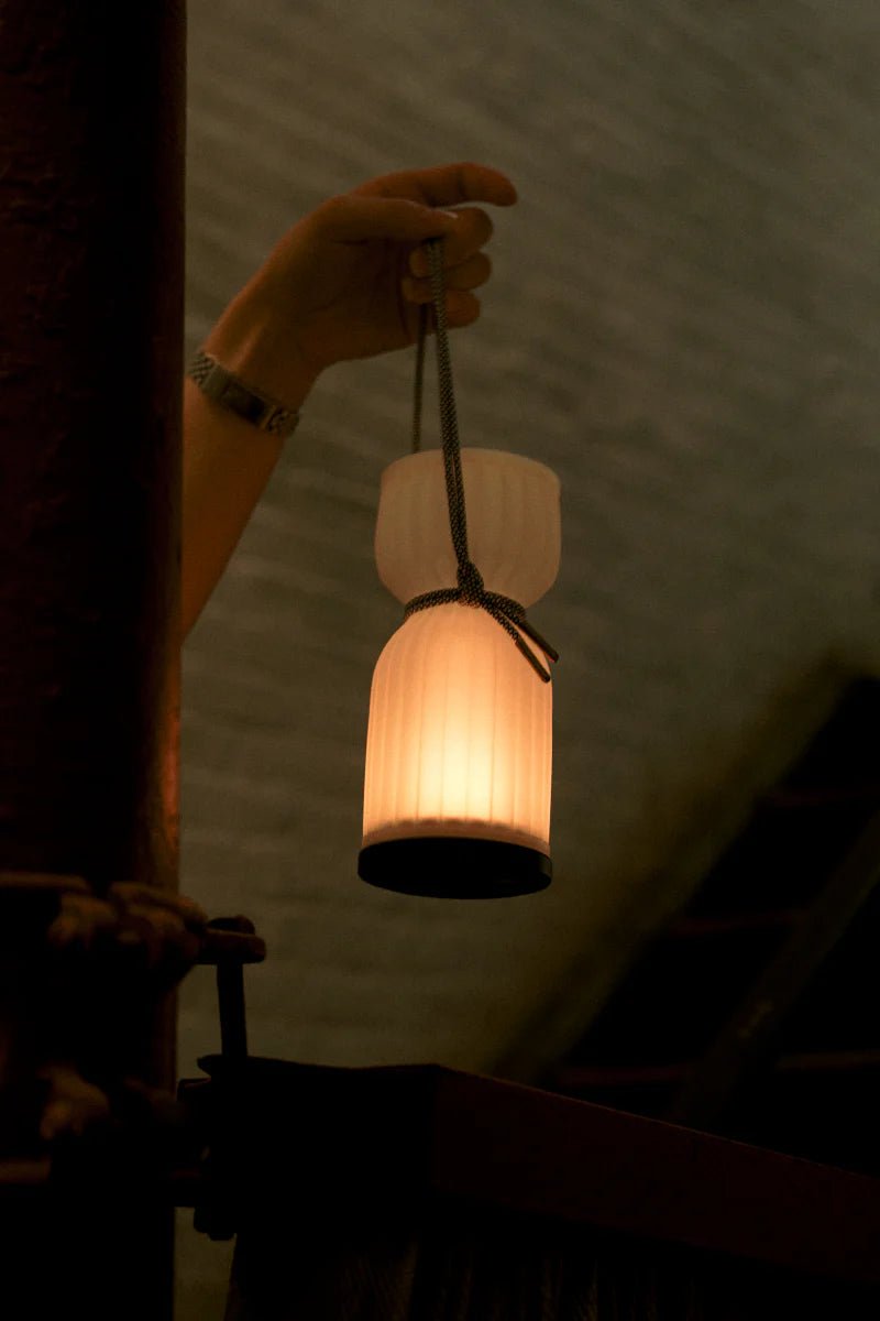 Initially inspired by the shape of water gourds and sake bottles, the Camp Lantern features a playful paracord sling handle, meant to encourage and highlight portability – hang it on a bedpost, take it on a picnic, or simply carry it with you around the house.&nbsp;
Cordless unit is USB-C rechargeable, features three dim-to-warm brightness settings, and lasts for up to 80 hours between charges.