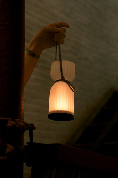 Initially inspired by the shape of water gourds and sake bottles, the Camp Lantern features a playful paracord sling handle, meant to encourage and highlight portability – hang it on a bedpost, take it on a picnic, or simply carry it with you around the house.&nbsp;
Cordless unit is USB-C rechargeable, features three dim-to-warm brightness settings, and lasts for up to 80 hours between charges.