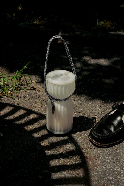 Initially inspired by the shape of water gourds and sake bottles, the Camp Lantern features a playful paracord sling handle, meant to encourage and highlight portability – hang it on a bedpost, take it on a picnic, or simply carry it with you around the house.&nbsp;
Cordless unit is USB-C rechargeable, features three dim-to-warm brightness settings, and lasts for up to 80 hours between charges.