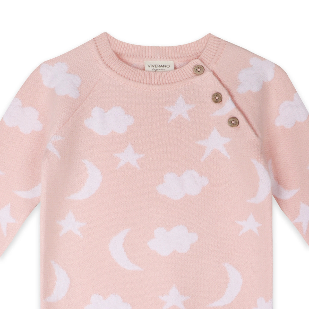 Pink baby sweater with white cloud, star, and moon patterns on a white background.