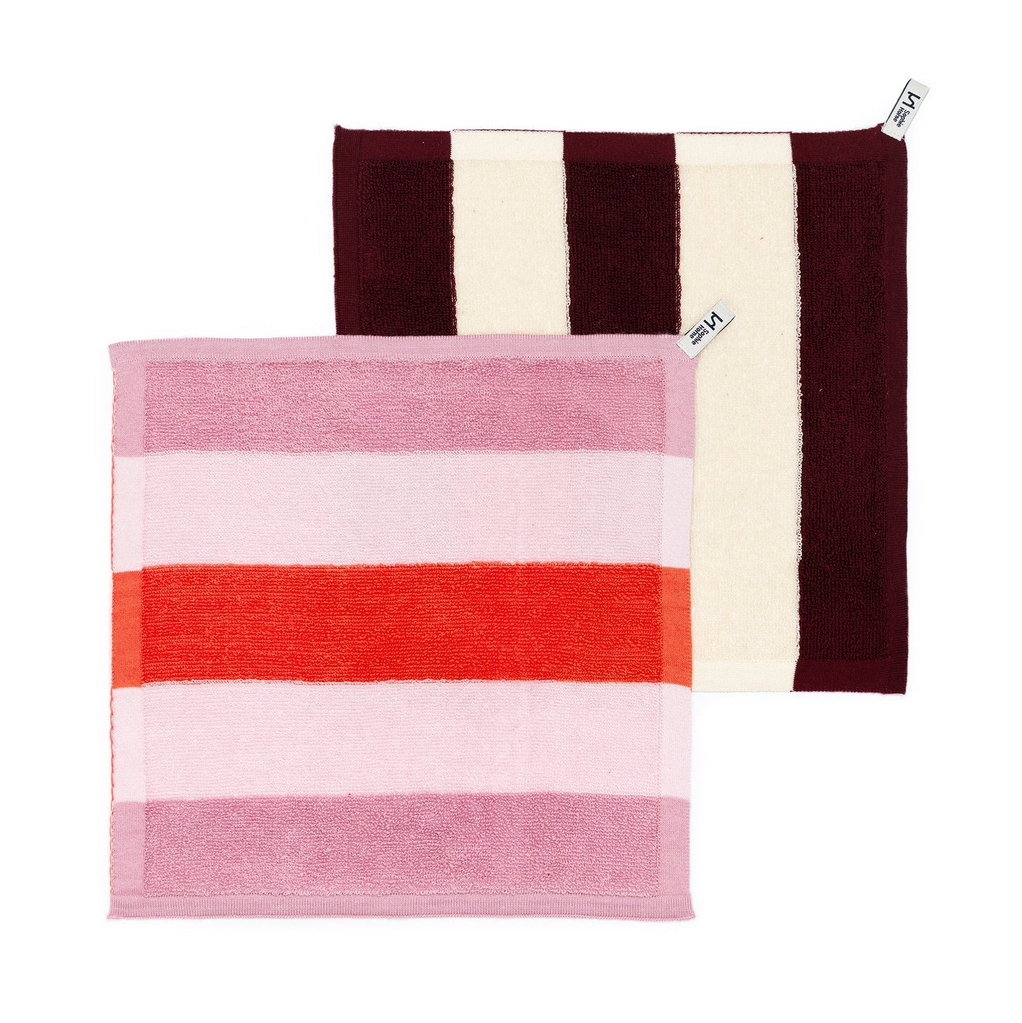 Two striped towels, one with red and pink horizontal stripes and the other with brown and white vertical stripes, on a white background.