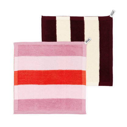 Two striped towels, one with red and pink horizontal stripes and the other with brown and white vertical stripes, on a white background.