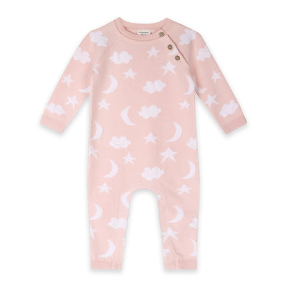 Baby onesie with star, moon, and cloud pattern on a pink background
